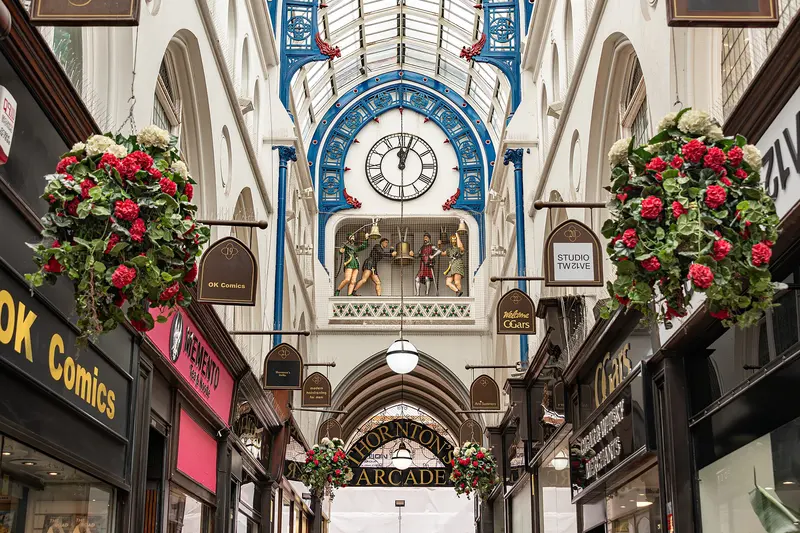 Thornton's Arcade with its clock and hanging flower baskets
