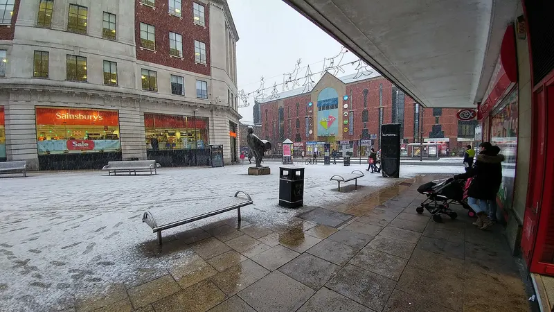 Dortmund Square in the snow, with the Drayman statue in the middle