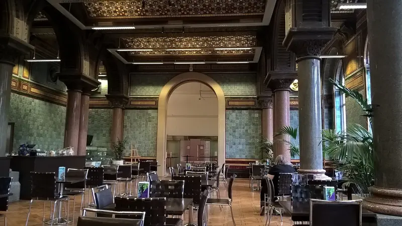 Tables in the tiled, pillared Tiled Hall café